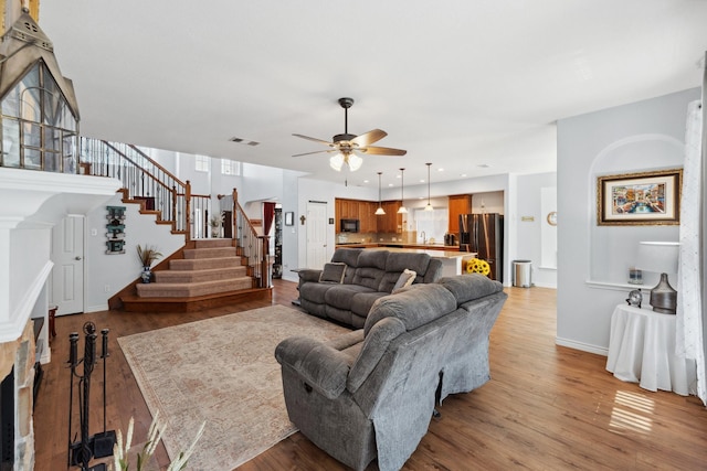 3532 Delaney Dr, Fort Worth, TX 76244 - living area with stairway, a ceiling fan, baseboards, light wood-style flooring, and recessed lighting