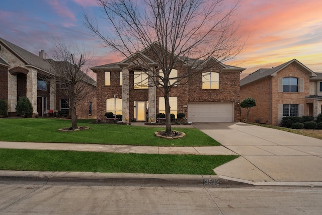 3532 Delaney Dr, Fort Worth, TX 76244 - view of front of house with a yard, an attached garage, concrete driveway, and brick siding