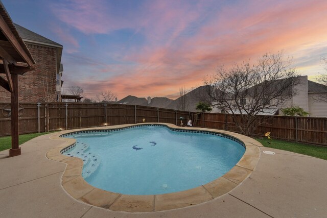 3532 Delaney Dr, Fort Worth, TX 76244 - pool at dusk with a fenced backyard and a patio area