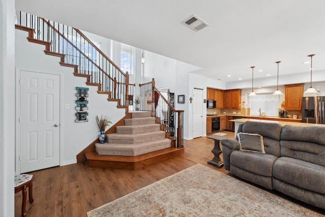 3532 Delaney Dr, Fort Worth, TX 76244 - living room with stairway, wood finished floors, baseboards, and recessed lighting