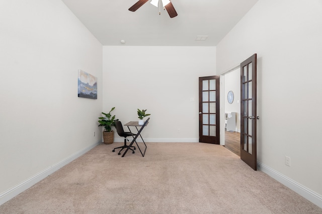 interior space with ceiling fan, baseboards, and french doors