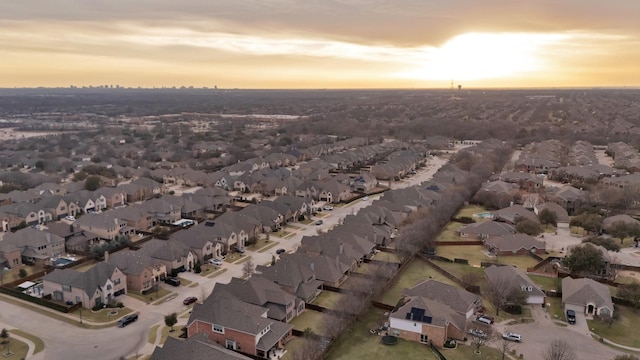 aerial view at dusk with a residential view