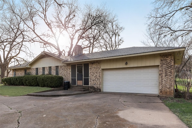 ranch-style house with entry steps, brick siding, driveway, and an attached garage