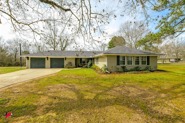 ranch-style house featuring a front yard, concrete driveway, brick siding, and an attached garage