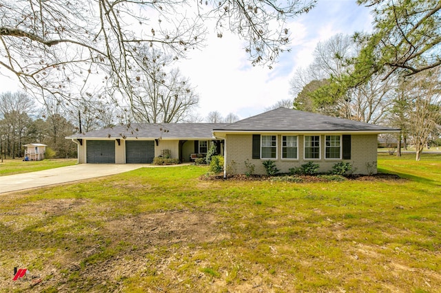 single story home featuring a garage, a front yard, concrete driveway, and brick siding