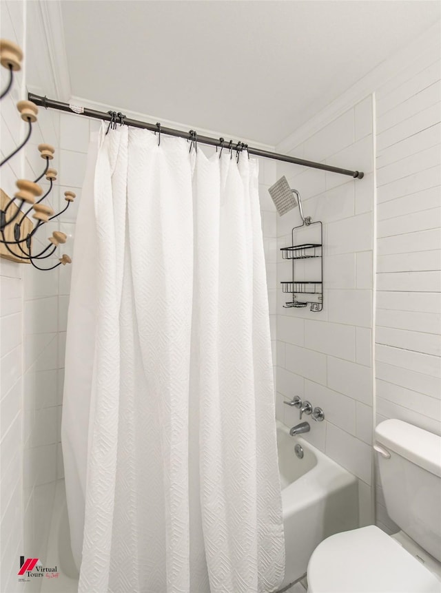 full bathroom featuring shower / bathtub combination with curtain and toilet