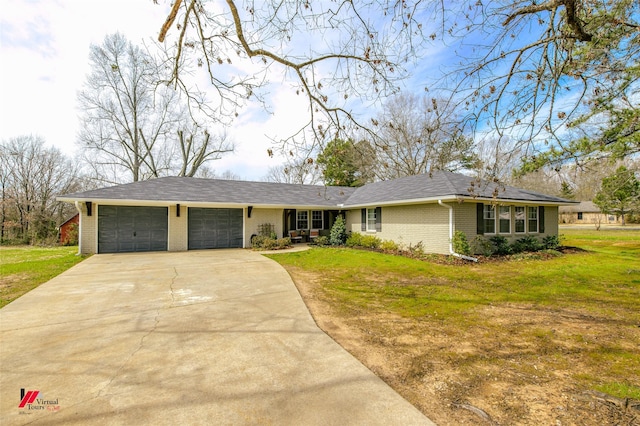 ranch-style home featuring a garage, a front yard, concrete driveway, and brick siding