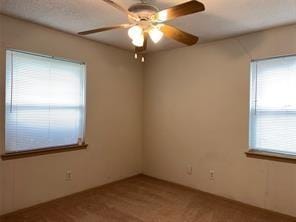 spare room with ceiling fan