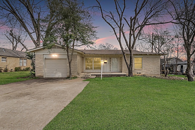 view of front of house with a front lawn, concrete driveway, stone siding, and an attached garage