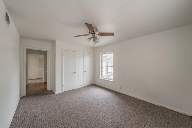 unfurnished bedroom featuring carpet floors, a closet, a ceiling fan, and baseboards