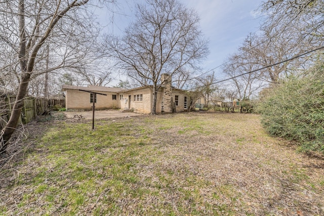 view of yard featuring a patio area and fence