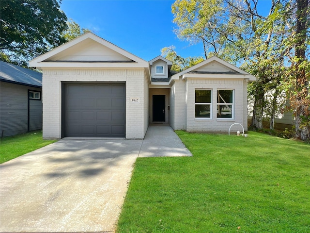view of front facade with driveway, a front yard, an attached garage, and brick siding
