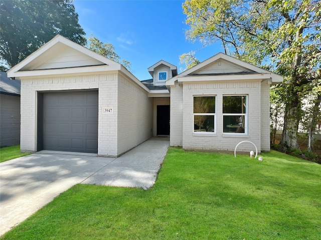 single story home featuring brick siding, driveway, a front lawn, and an attached garage
