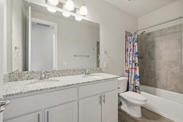 4303 Juniper Ln, Melissa, TX 75454 - bathroom featuring a sink, toilet, wood finished floors, and double vanity