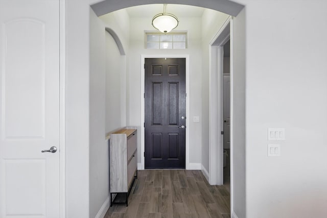 4303 Juniper Ln, Melissa, TX 75454 - interior space featuring arched walkways, dark wood-style flooring, and baseboards
