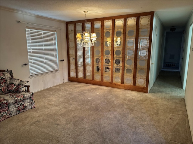 carpeted living room with visible vents and an inviting chandelier