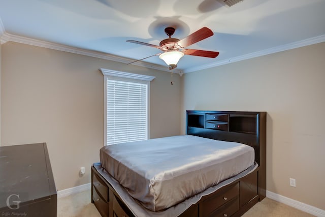 bedroom featuring ornamental molding, a ceiling fan, light colored carpet, and baseboards