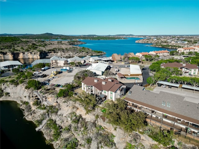 drone / aerial view featuring a water view and a residential view