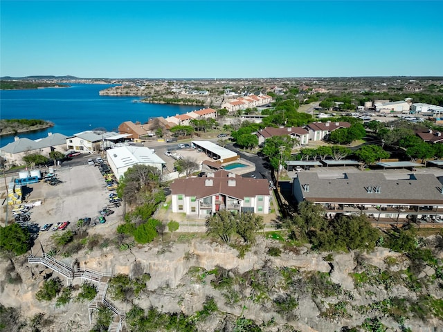 birds eye view of property with a water view and a residential view