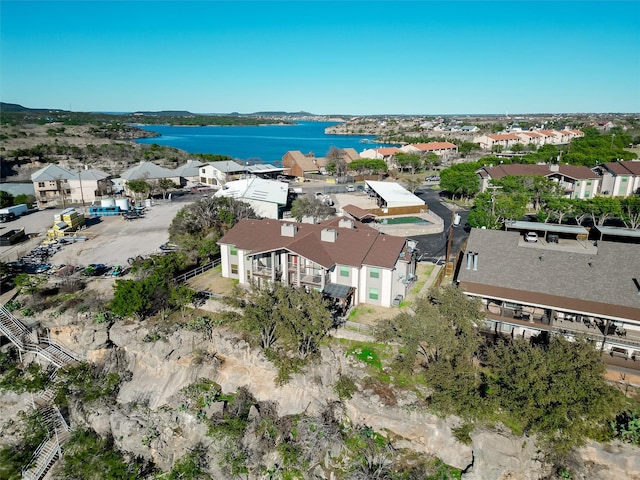 birds eye view of property featuring a water view and a residential view