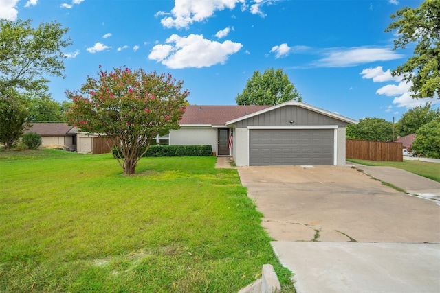 ranch-style house with driveway, a front lawn, an attached garage, and fence