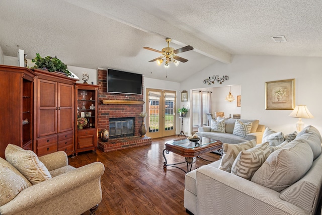 living room with a ceiling fan, lofted ceiling with beams, dark wood-style flooring, a textured ceiling, and a fireplace