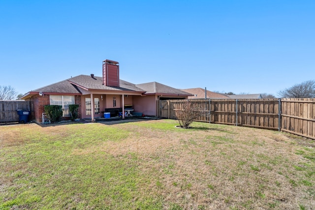 view of yard with a fenced backyard