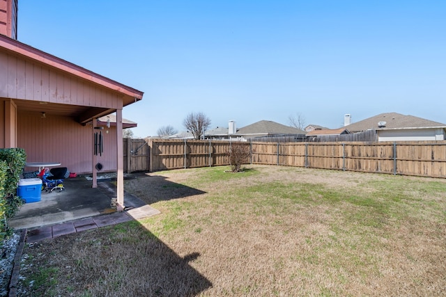 view of yard with a patio area and a fenced backyard