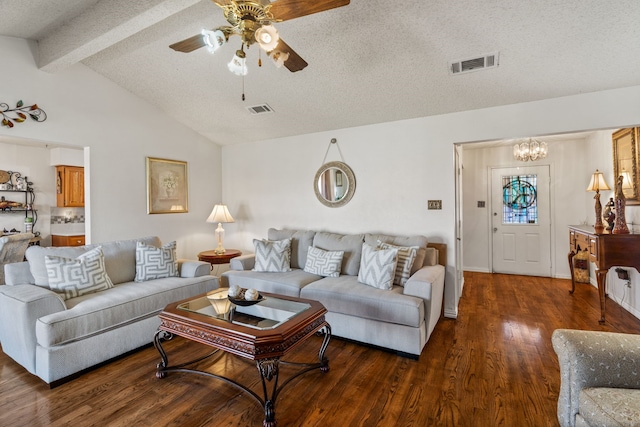 living room featuring visible vents, vaulted ceiling with beams, a textured ceiling, and wood finished floors