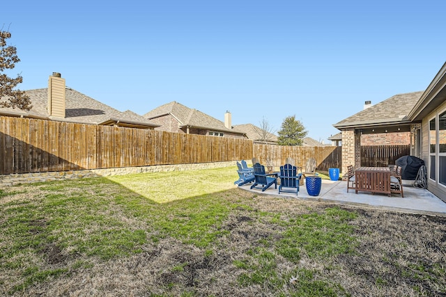 view of yard with a fenced backyard and a patio