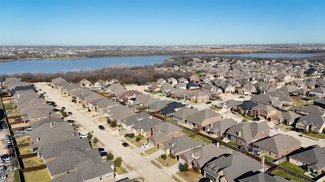 bird's eye view with a residential view and a water view