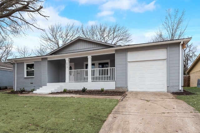 single story home featuring concrete driveway, an attached garage, a front yard, a porch, and brick siding