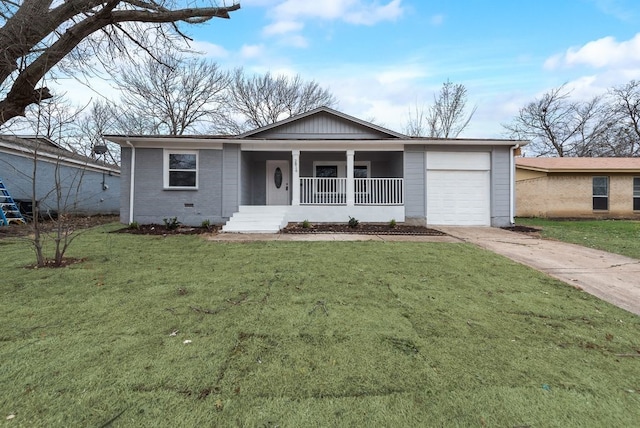 single story home featuring brick siding, concrete driveway, covered porch, a garage, and a front lawn