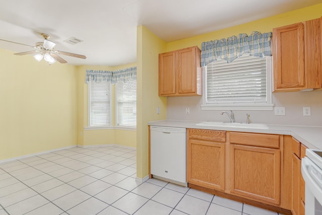 kitchen with white dishwasher, stove, a sink, visible vents, and a ceiling fan