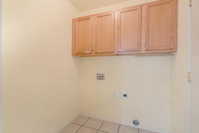 washroom featuring cabinet space, light tile patterned floors, baseboards, hookup for a washing machine, and hookup for an electric dryer