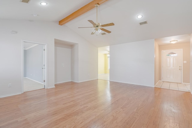 unfurnished room featuring vaulted ceiling with beams, visible vents, light wood-style flooring, ceiling fan, and baseboards