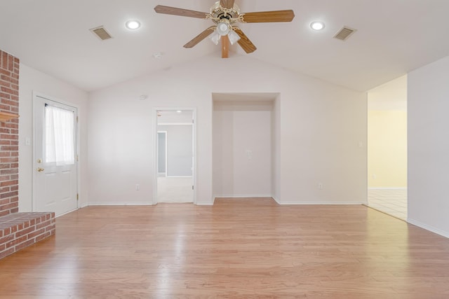 unfurnished living room with lofted ceiling, visible vents, ceiling fan, and light wood finished floors