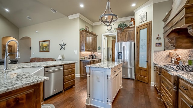 kitchen with visible vents, dark wood-style flooring, light stone countertops, custom exhaust hood, and stainless steel appliances