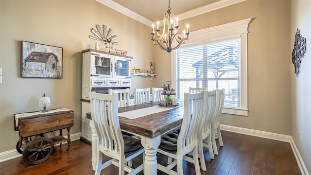 dining room featuring dark wood-style floors, crown molding, baseboards, and an inviting chandelier