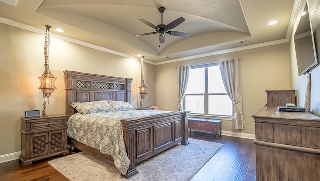 bedroom with dark wood-style floors, lofted ceiling, visible vents, ornamental molding, and baseboards