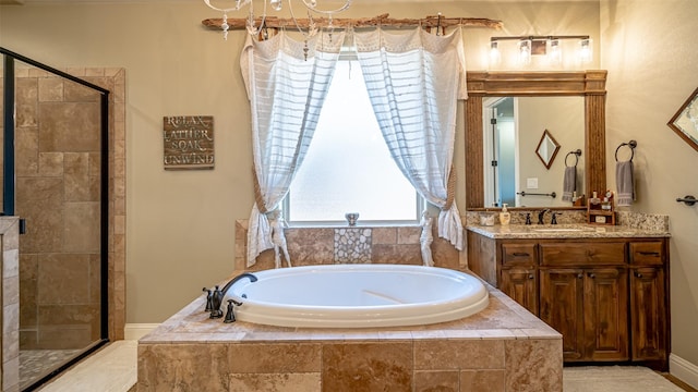 full bath with a shower stall, vanity, and a bath