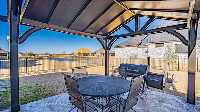 view of patio with a residential view, outdoor dining area, and a fenced backyard