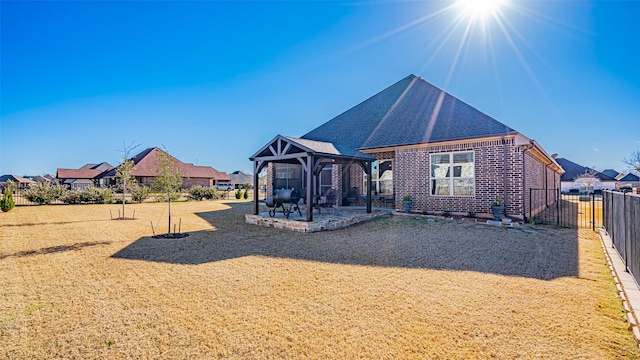 view of play area featuring a patio area, a yard, fence, and a gazebo