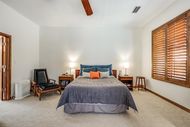 bedroom with a ceiling fan, baseboards, visible vents, and carpet flooring