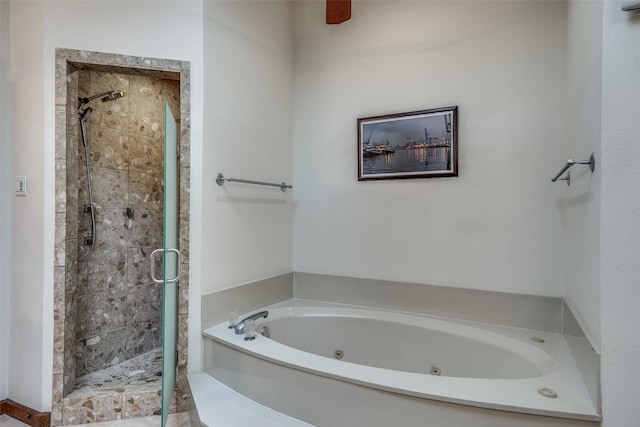 bathroom with a shower stall and a whirlpool tub