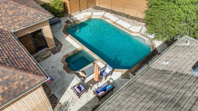 exterior space with fence, a fenced in pool, and a patio