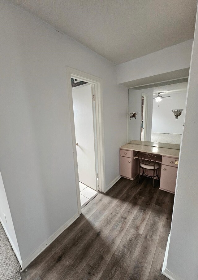 5825 Birchbrook Dr Unit 106, Dallas, TX 75206 - bathroom with vanity, wood finished floors, baseboards, ceiling fan, and a textured ceiling