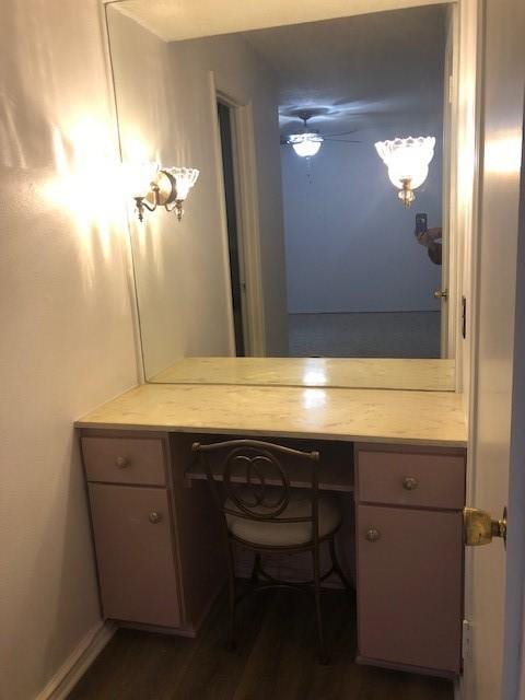 bathroom with ceiling fan, wood finished floors, and vanity