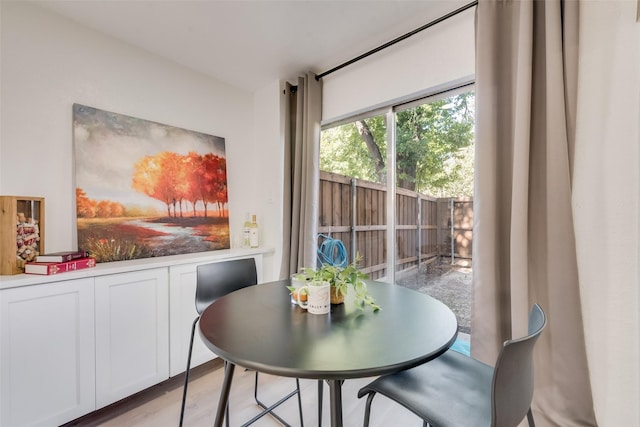 dining space with light wood-type flooring