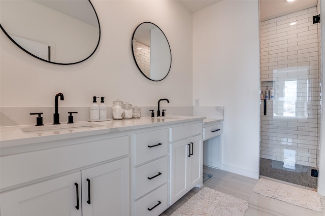 full bath with double vanity, a sink, and a shower stall